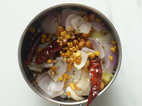 adding cooled ingredients to make ginger chutney