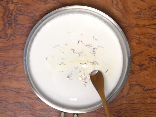 soaking saffron in milk to make hyderabadi biryani