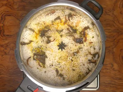 steaming hot hyderabadi biryani after dum cooking