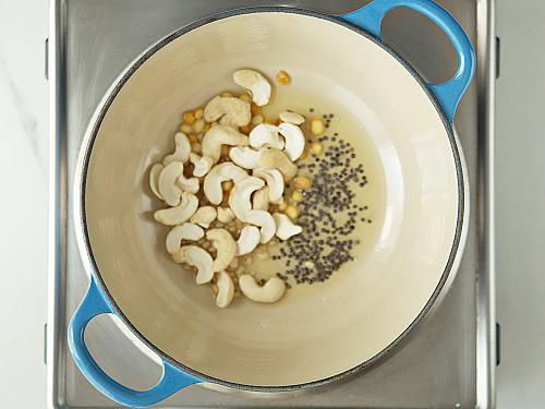 frying cashews urad dal to make khara bhath