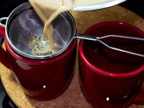 filter masala chai through strainer