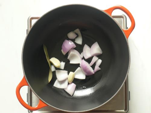 frying onions garlic bay leaf to make tomato soup recipe