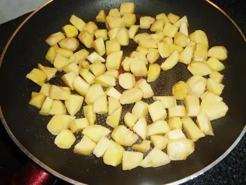 frying ginger in oil for making allam pachadi