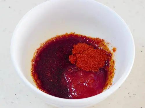 adding sauces to a bowl