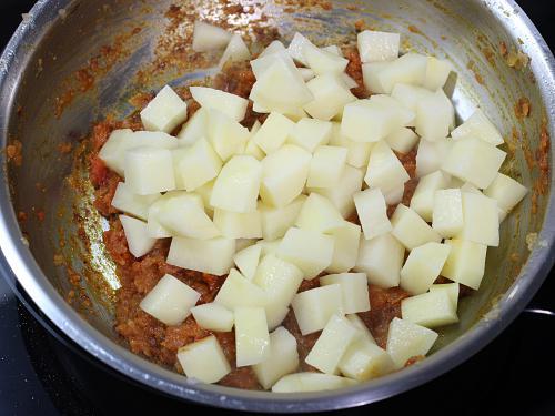 adding potatoes for curry