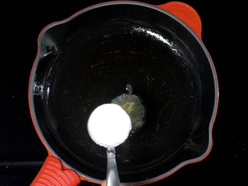 adding flour to butter