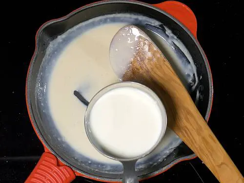 pouring milk to sauce