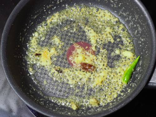 adding ginger garlic paste to make paneer makhani 