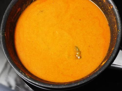 pouring water to make paneer makhani