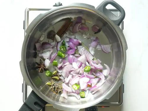 frying onions to make veg biryani