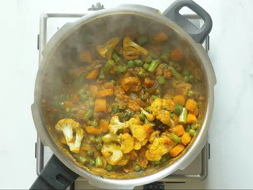 frying veggies to make veg biryani