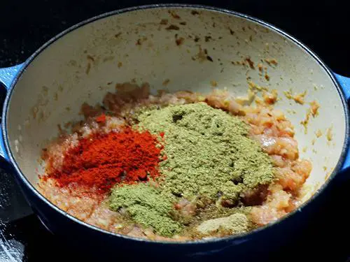 adding spice powders to make eggplant curry