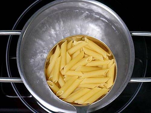 boiling pasta to a pot