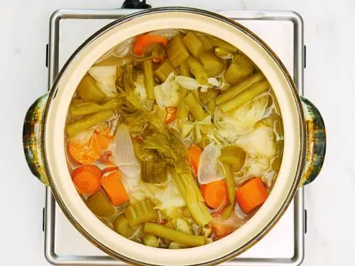 making clear soup in pot