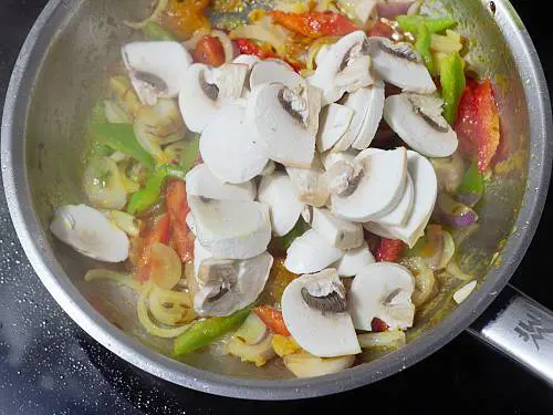 making mushroom pepper fry in steel pan