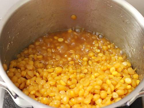cooking chana dal and jaggery syrup for boorelu recipe