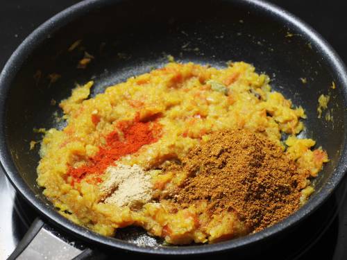 adding masala powders for chole recipe