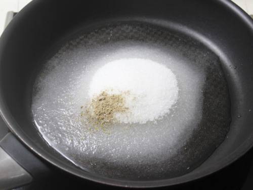 sugar and water in a pan to make badam burfi
