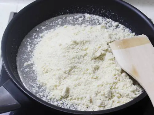 adding almond meal to the sugar syrup