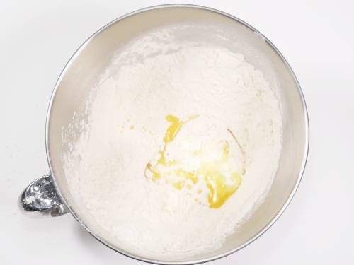 mixing flour salt curd oil for bhatura recipe