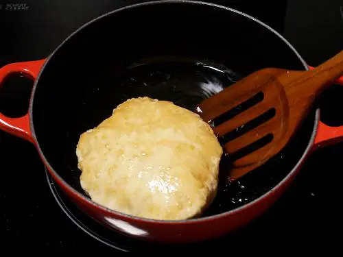 puffed bhatura in hot oil