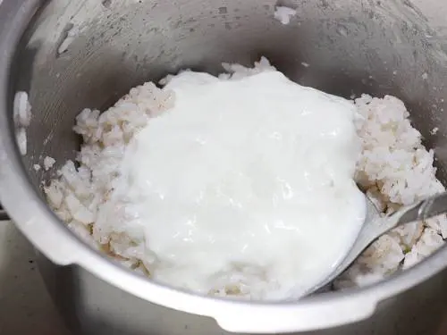addition of yogurt to rice pot to make thayir sadam recipe