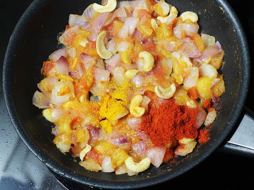 adding spice powders to make paneer tikka masala