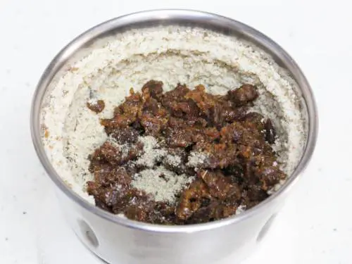 adding jaggery and cardamom powder for walnut ladoo