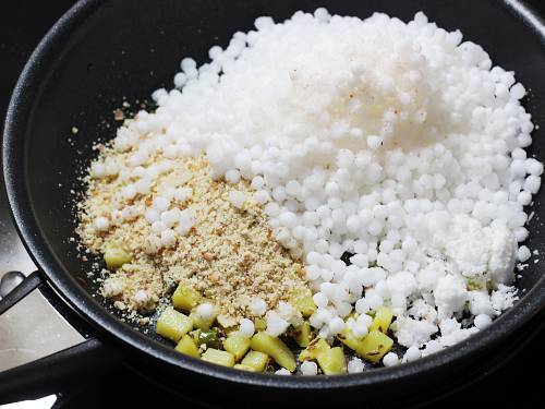 adding sabudana crushed peanuts and salt