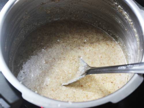 mixing walnut burfi mixture