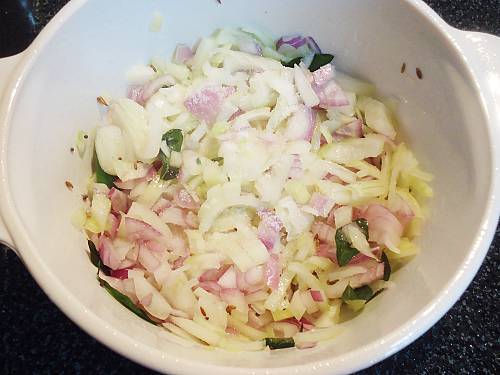 frying onions to make drumstick curry