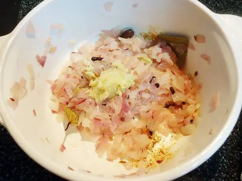 frying ginger garlic paste to make fish tikka masala