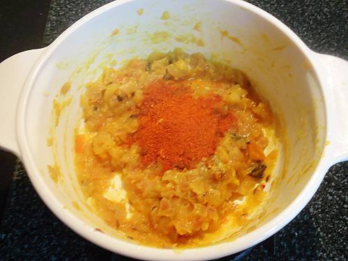 adding spice powders to make fish tikka masala