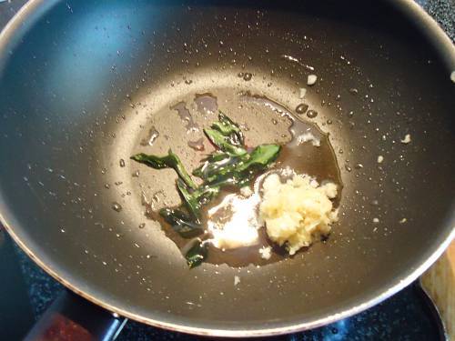 frying ginger garlic to make hariyali chicken