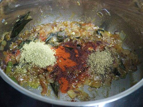 sauteing masala to make green gram curry