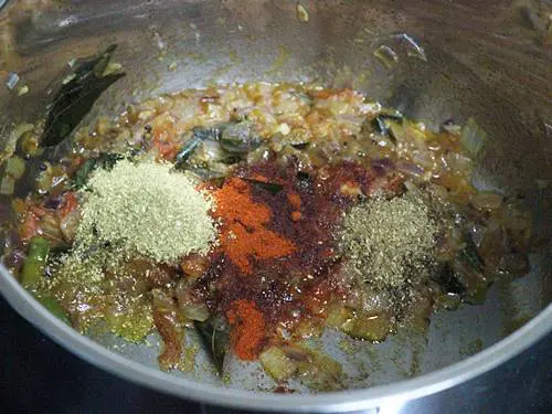 sauteing  masala to make green gram curry