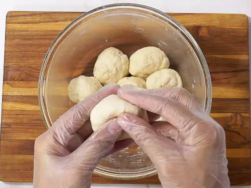 making dough balls for naan