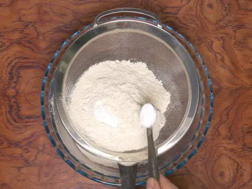 sieve flour leavening agents to make eggless orange cake