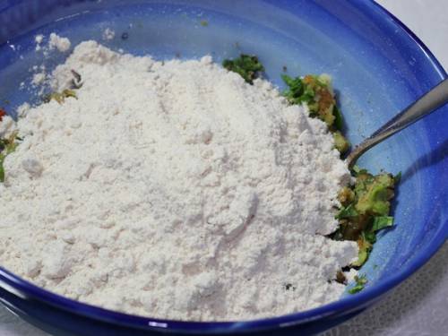 adding flour to veggies
