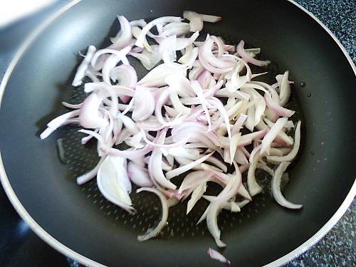 frying onions for paneer biryani