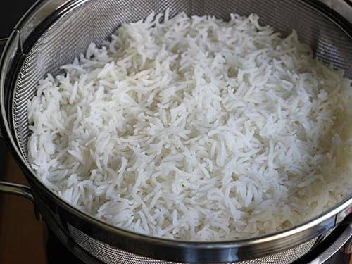 drained rice in a colander.