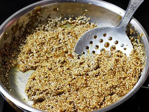 sesame seeds in jaggery syrup to make laddu