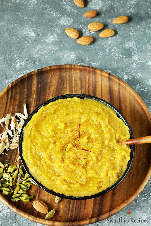 badam halwa garnished with saffron & served in a black bowl