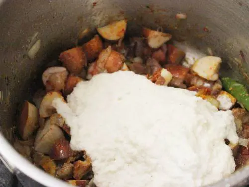 adding the ground coconut paste