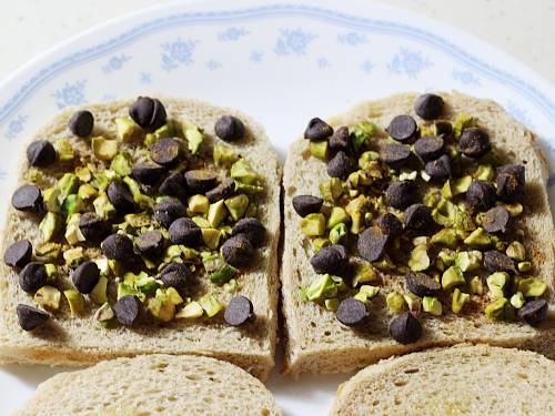 adding choco chips and nuts to make chocolate sandwich