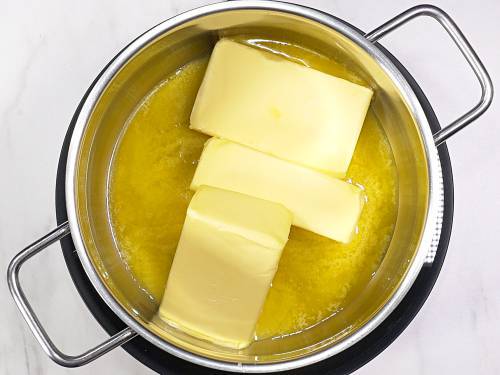 melting butter in a pot to make ghee