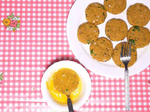 dipping shami kebab in egg