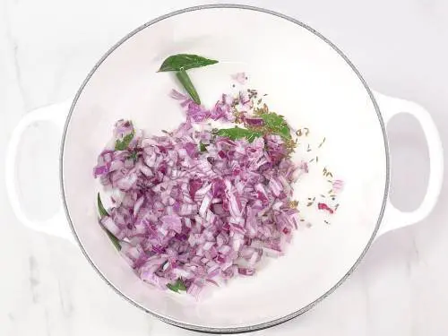 frying onions to make cauliflower curry