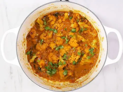 garnish cauliflower curry with coriander leaves