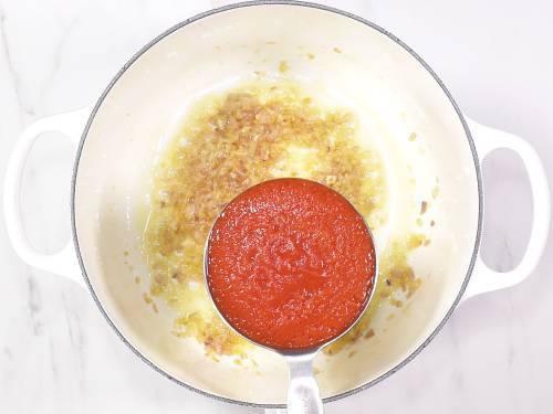 adding pureed tomatoes to make dal makhani
